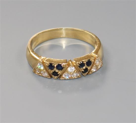 A modern 585 yellow metal and two colour sapphire? cluster half hoop ring, size O.